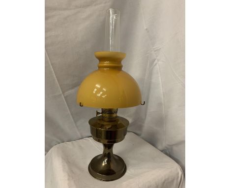 A BRASS OIL LAMP WITH COLOURED GLASS SHADE H" 61CM 