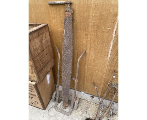 A VINTAGE CROSS CUT SAW AND A VINTAGE SACK TRUCK 