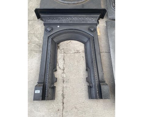 A DECORATIVE CAST IRON FIRE SURROUND 