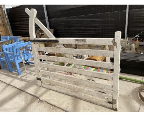 A WHITE PAINTED WOODEN GATE 