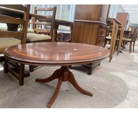 A REPRODUCTION OVAL MAHOGANY AND INLAID COFFEE TABLE