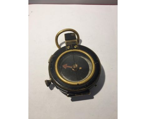 A MILITARY COMPASS DATED 1917 