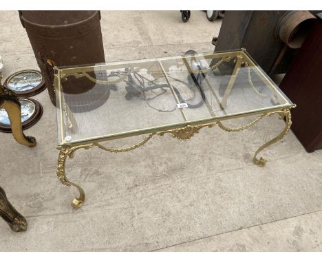 A GILT METAL REGENCY STYLE COFFEE TABLE, 34X16" , WITH TOUGHENED SAFETY GLASS TOP 