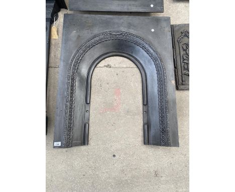 A DECORATIVE CAST IRON FIRE SURROUND 