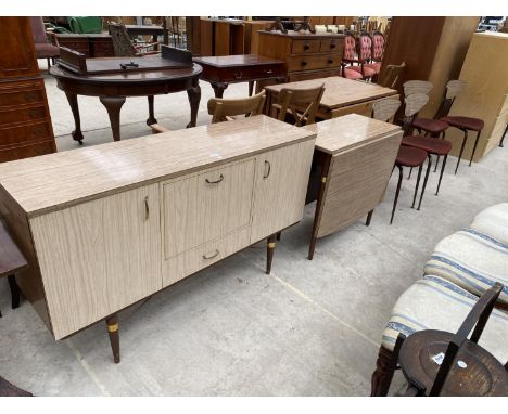 A MID 20TH CENTURY CREAMY WALNUT EFFECT DINING ROOM SUITE COMPRISING SIDEBOARD/COCKTAIL UNIT ENCLOSING THREE CUPBOARDS, DROP-