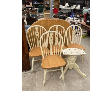 AN EXTENDING PEDESTAL DINING TABLE AND FOUR WHEELBACK CHAIRS 