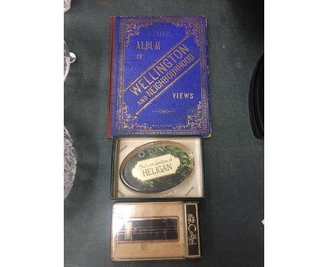 A PAPERWEIGHT, BOXED COLIBRI LIGHTER AND AN ALBUM OF WELLINGTON AND NEIGHBOURHOOD VIEWS 