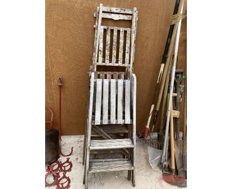 A VINTAGE FOUR RUNG WOODEN STEP LADDER AND TWO FURTHER TWO RUNG WOODEN STEP LADDERS 