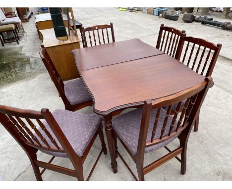 A MODERN EXTENDING DINING TABLE AND SIX SPINDLE BACK DINING CHAIRS 