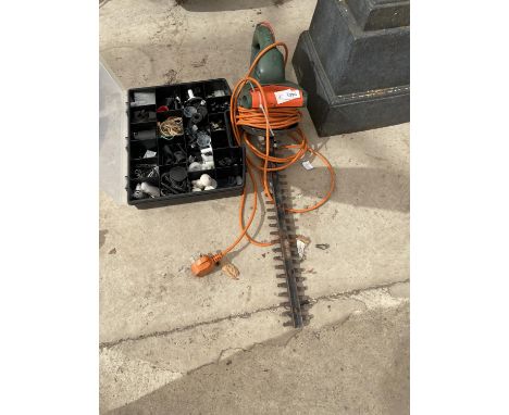 AN ELECTRIC HEDGE TRIMMER AND A TOOL BOX CONTAINING HARD WARE 