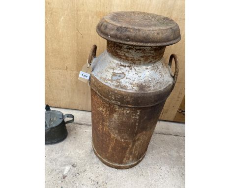 A VINTAGE MILK CHURN WITH LID 