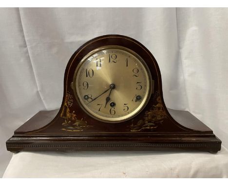 A MAHOGANY MANTLE CLOCK WITH AN ORIENTAL PATTERN 45CM LENGTH 