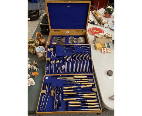 A LIGHT OAK BOXED CANTEEN OF CUTLERY WITH TWO ADDITIONAL TRAYS 