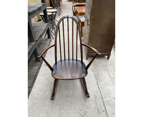 AN ERCOL ROCKING CHAIR STAMPED B.S.1-1960 (2056) 