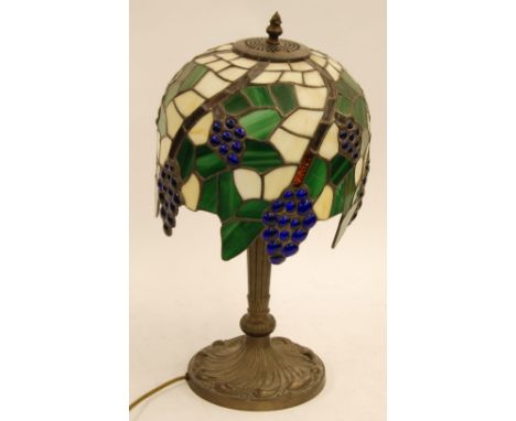 REPRODUCTION TIFFANY GILT METAL TABLE LAMP, with 'leaded' shape in a fruiting vine design, 19" (48.3cm) high, TOGETHER WITH A