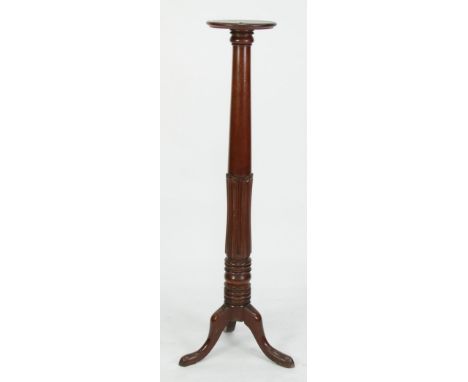 EARLY NINETEENTH CENTURY CARVED MAHOGANY TORCHERE, the moulded circular top above a tapering column with tulip carved border,