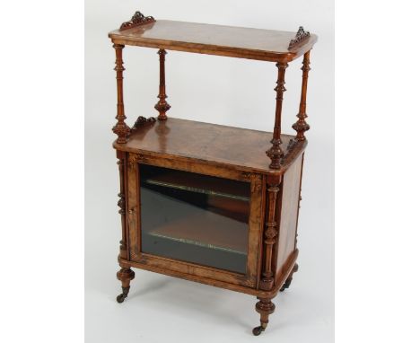 VICTORIAN BURR WALNUT AND MARQUETRY INLAID MUSICAL CANTERBURY WHAT-NOT, the rounded oblong top with pierced surmounts above a