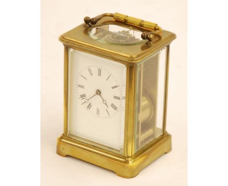 LATE NINETEENTH CENTURY FRENCH BRASS CARRIAGE CLOCK with chiming movement, the white Roman dial indistinctly signed, powered 