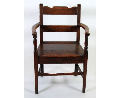 LATE EIGHTEENTH CENTURY OAK OPEN ARMCHAIR, with shaped top rail and shaped flat arms with turned supports, enclosing a flat f