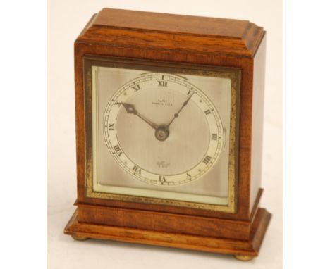 ELLIOTT, MAHOGANY CASED MANTEL CLOCK, retailed by Batty, Manchester, with silvered square Roman dial and keywind movement