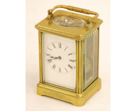 HENRI JACOT (LATE 19th CENTURY FRENCH) PRESENTATION BRASS CHIMING CARRIAGE CLOCK, the white enamelled Roman dial powered by a