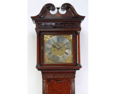 LATE EIGHTEENTH CENTURY CARVED AND CROSSBANDED OAK LONGCASE CLOCK, signed Barker, Wigan, the 13" brass dial with silvered cha