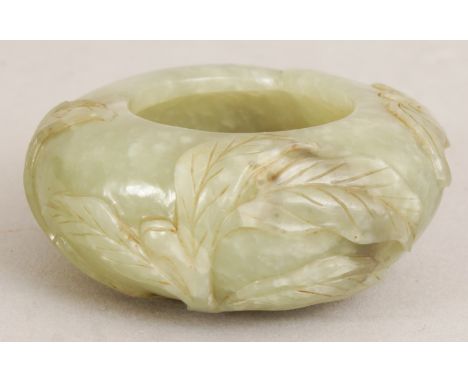 A GOOD SMALL 18TH/19TH CENTURY CHINESE JADE WATER POT, circa 1800, the rounded sides of the peach-form body carved in high re