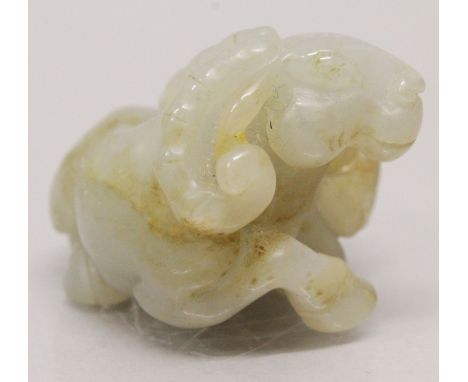 A CHINESE GREY JADE MODEL OF A RAM & ITS YOUNG, the stone with russet inclusions, 1.9in long.