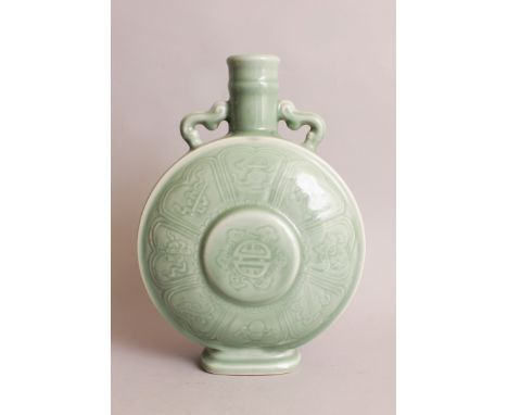 A CHINESE CELADON PORCELAIN MOON FLASK, each domed surface centred by a raised Shou symbol encircled by ribboned Buddhist emb