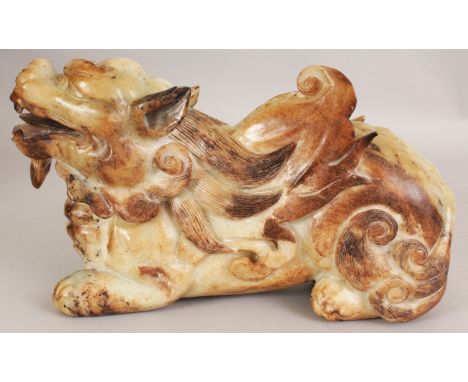 A LARGE 20TH CENTURY CHINESE CELADON BROWN NEPHRITE JADE MODEL OF A PIXIU WINGED MYTHICAL CREATURE, the stone of mixed celado