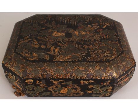 A GOOD 19TH CENTURY CHINESE LACQUERED WOOD GAMES BOX & COVER, of chamfered rectangular form, the interior fitted with numerou