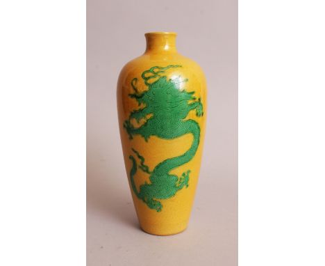 A CHINESE GREEN ENAMELLED YELLOW GROUND PORCELAIN DRAGON VASE, the base with a six-character Kangxi mark, 7.8in high.