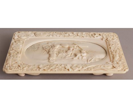 A FINE QUALITY SIGNED JAPANESE MEIJI PERIOD RECTANGULAR IVORY TRAY, with indented corners and supported on four bracket feet,