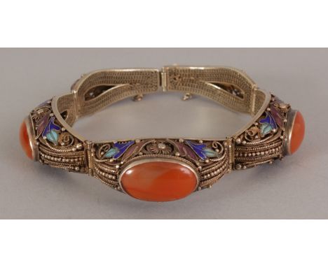 A GOOD QUALITY CHINESE ENAMELLED SILVER-METAL & AGATE INSET BANGLE, approx. 3in wide at widest point.