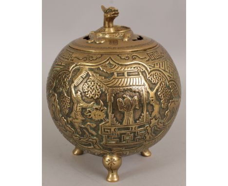AN EARLY 20TH CENTURY CHINESE POLISHED BRONZE TRIPOD CENSER & COVER, cast with figural panels and a linked wan ground, the ba