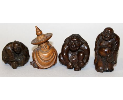 A GROUP OF THREE JAPANESE CARVED WOOD NETSUKE, the tallest 2.3in high; together with a small wood carving of a seated sleepin