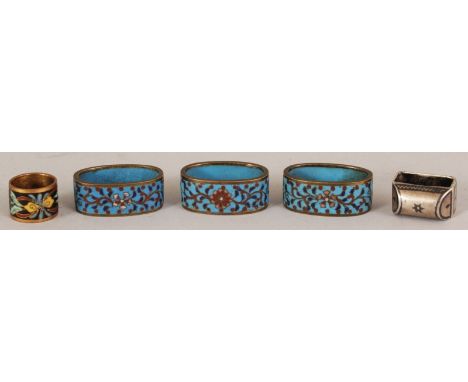 FOUR SMALL 19TH/20TH CENTURY CHINESE CLOISONNE RINGS, one circular and three oval, the larger oval rings 1.1in wide; together