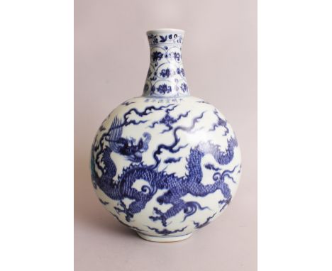 A CHINESE MING STYLE BLUE & WHITE PORCELAIN DRAGON MOON FLASK, the domed sides decorated with two dragons amidst cloud and fl