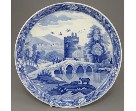 An early nineteenth century blue and white transfer-printed Spode Lucano pattern circular cheese stand, c. 1820. It is marked