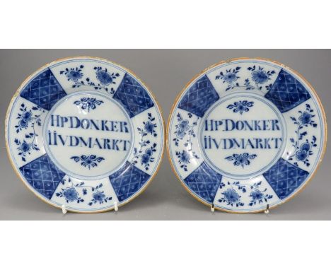 A superb pair of eighteenth century tin glazed earthenware blue and white delft dedicated plates, c. 1765-70. Both are decora