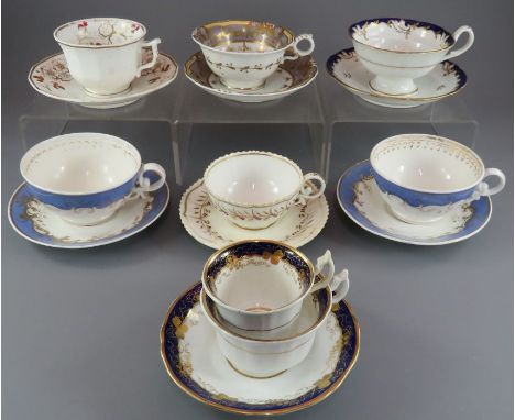 A group of early nineteenth century hand-painted mainly Spode porcelain cups and saucers and one trio, c. 1820-25. Saucers: 1