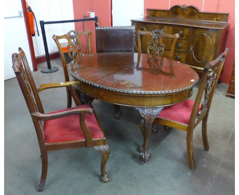 An Edward VII Chippendale Revival mahogany dining suite, comprising dining table, four chairs and sideboard