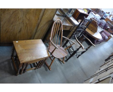 An Ercol rocking chair, an oak barleytwist nest of tables and a spindle back chair