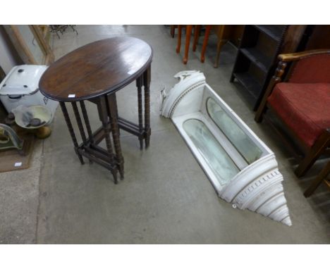 An oak nest of tables and a painted hanging corner shelf