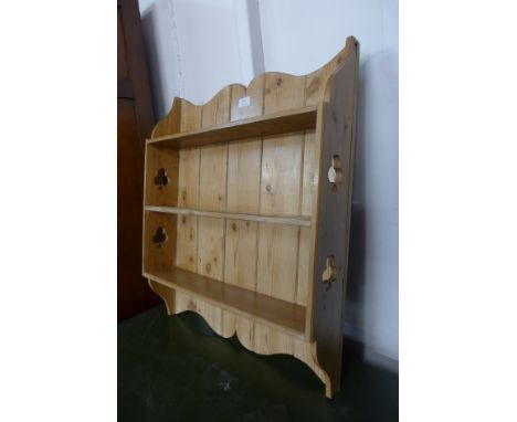 A small pine wall shelf