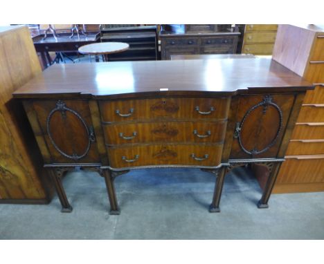 An Edward VII Chippendale Revival carved mahogany sideboard