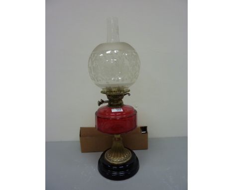 Early 20th oil lamp with cranberry glass reservoir H57cm