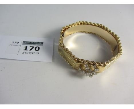 Octagonal hinged bangle bright cut decoration with rope twist borders set with twenty brilliant cut diamonds stamped 14K appr