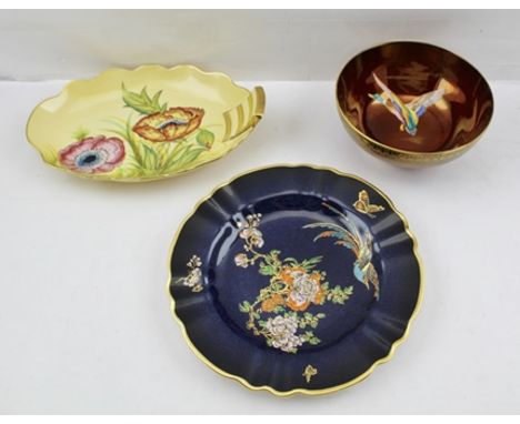 THREE ITEMS OF CARLTONWARE comprising; an elliptical bowl, a round bowl plus a cabinet plate with jewelled polychrome decorat