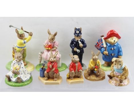 A COLLECTION OF ROYAL DOULTON CERAMIC FIGURES "The Bunnykins" Series comprising; "Sitting on Suitcase", "On The Fairway", "Wi